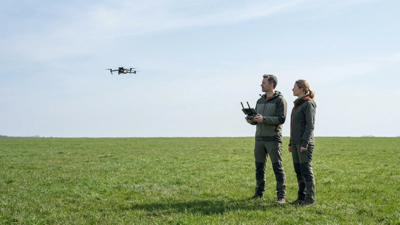 DJI Air 3S pilot and observer maintaining visual line of sight during a controlled flight