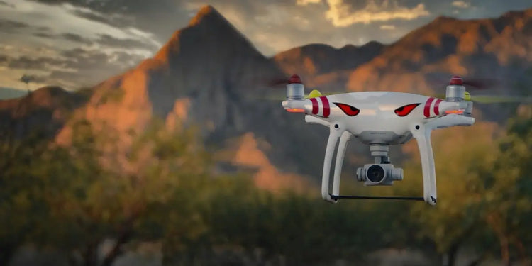 Drone flying over a desert landscape with mountains in the background