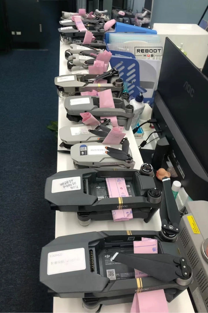 DJI drones arranged in the Reboot Hub repair and inspection queue