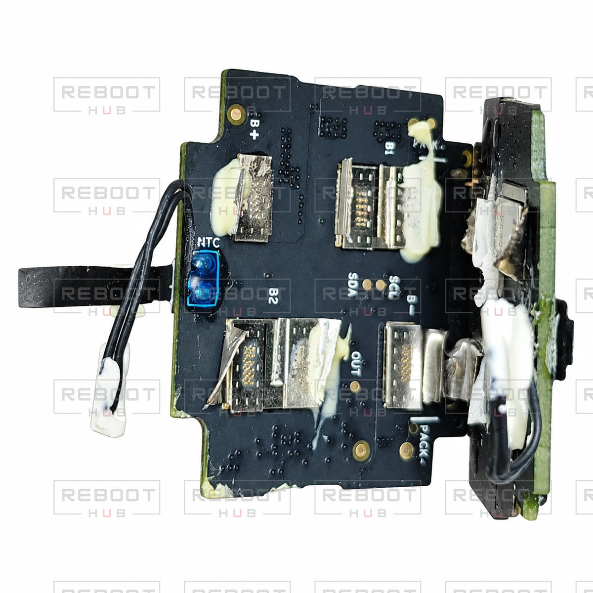 OEM-pulled DJI Air 2S Battery Motherboard on white with Reboot Hub watermark overlay — view 5