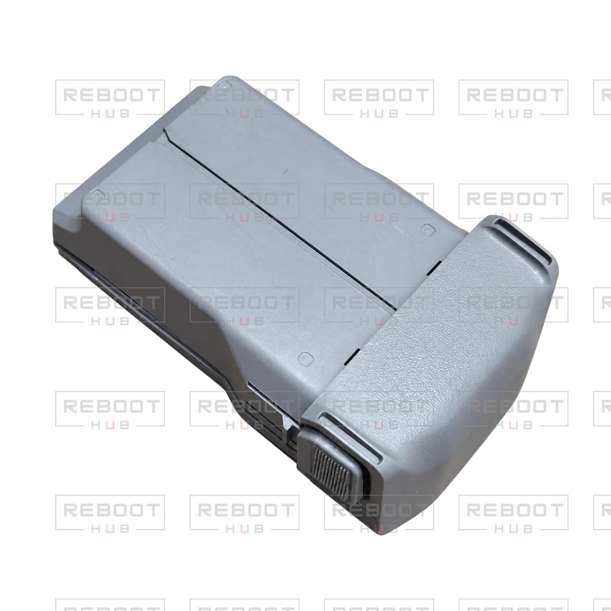 OEM-pulled DJI Mini 5 Pro Battery Cover on white with Reboot Hub watermark overlay